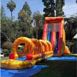 Orange and yellow slip and slide waterslide
